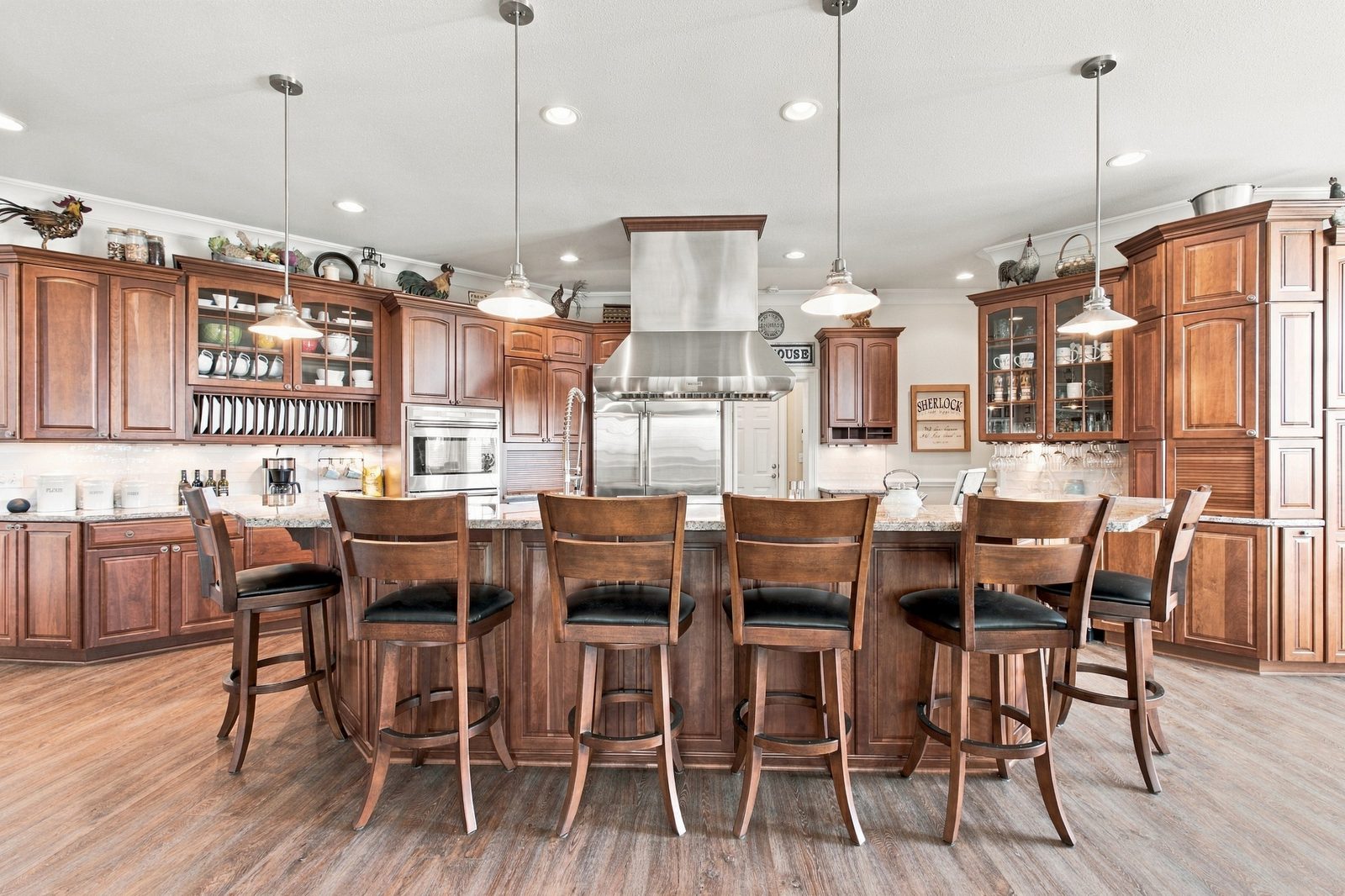 The custom chef's kitchen with Wolf and Sub-Zero appliances and generous cabinetry